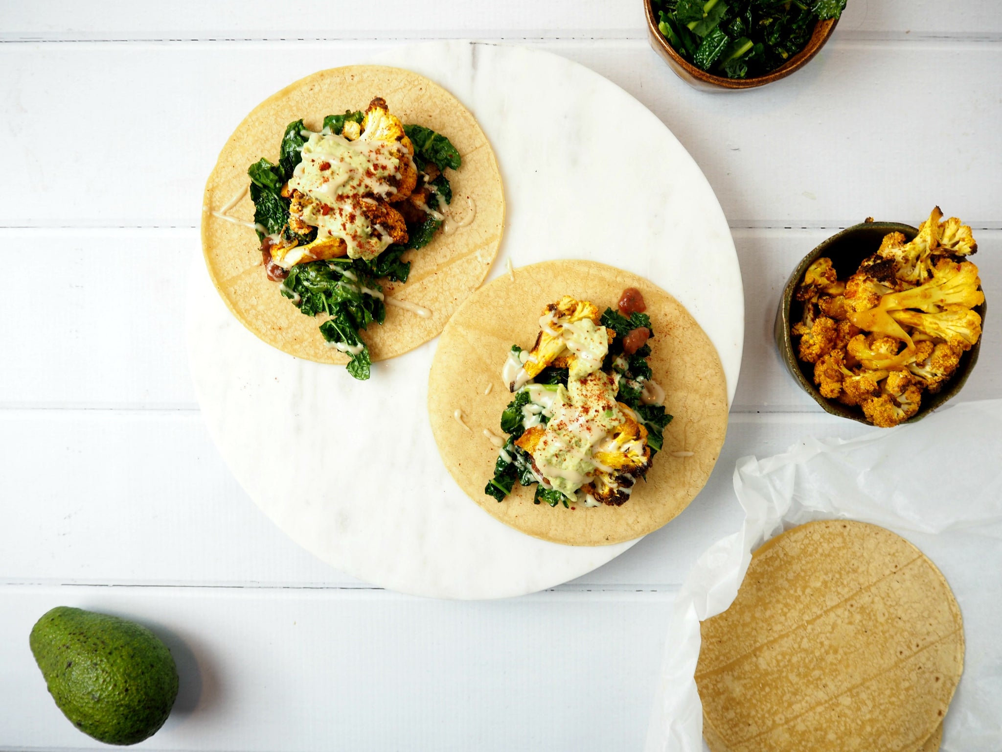 Roasted Cauliflower Tacos with Spicy Kale and Avocado Cream